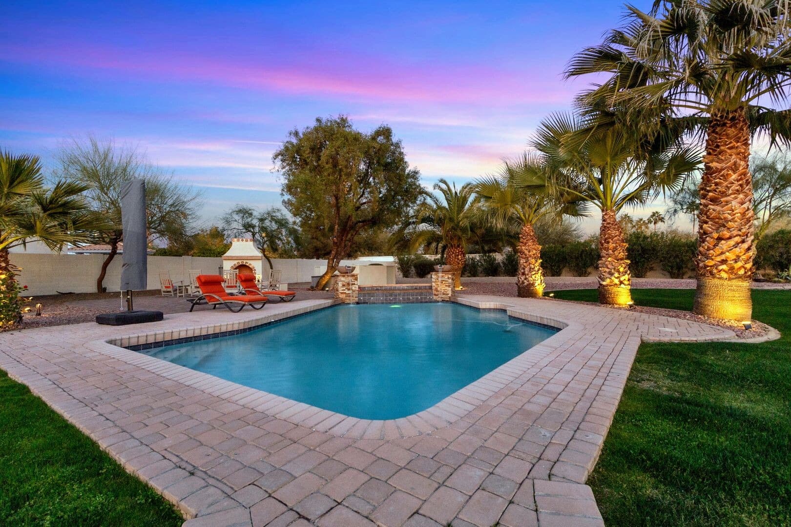 Luxurious swimming pool area featuring crystal clear water and modern lounge seating