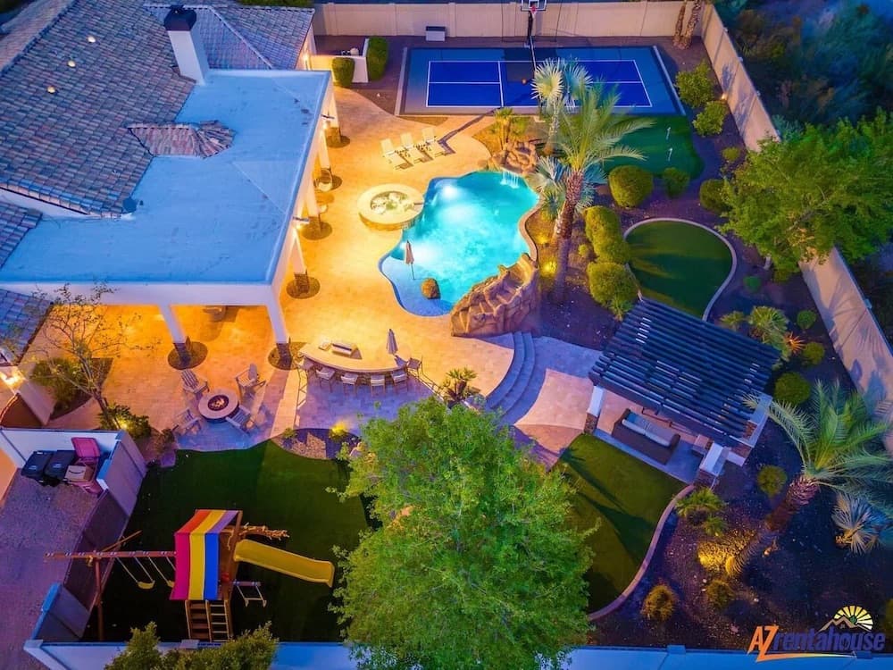 Beautifully manicured backyard garden with outdoor living space and desert landscaping